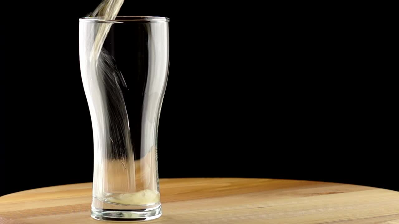 Free Video Stock the beer poured into a glass on a table Live Wallpaper - Free Download