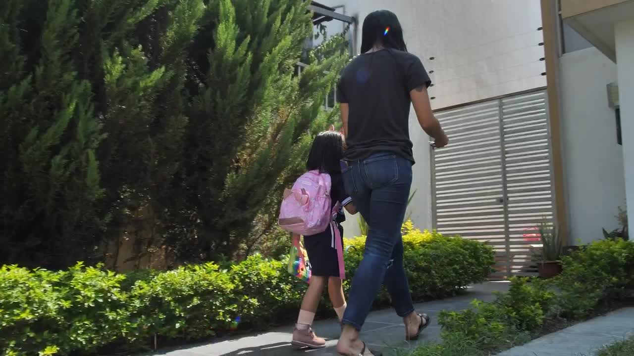 Stock Video Mother Coming Home After Picking Up Her Daughter From Schoo Animated Wallpaper - Free Download