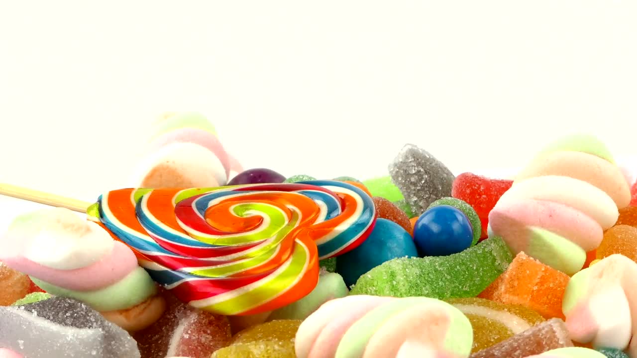 Free Video Stock sweet candies of different types on white background Live Wallpaper - Free Download