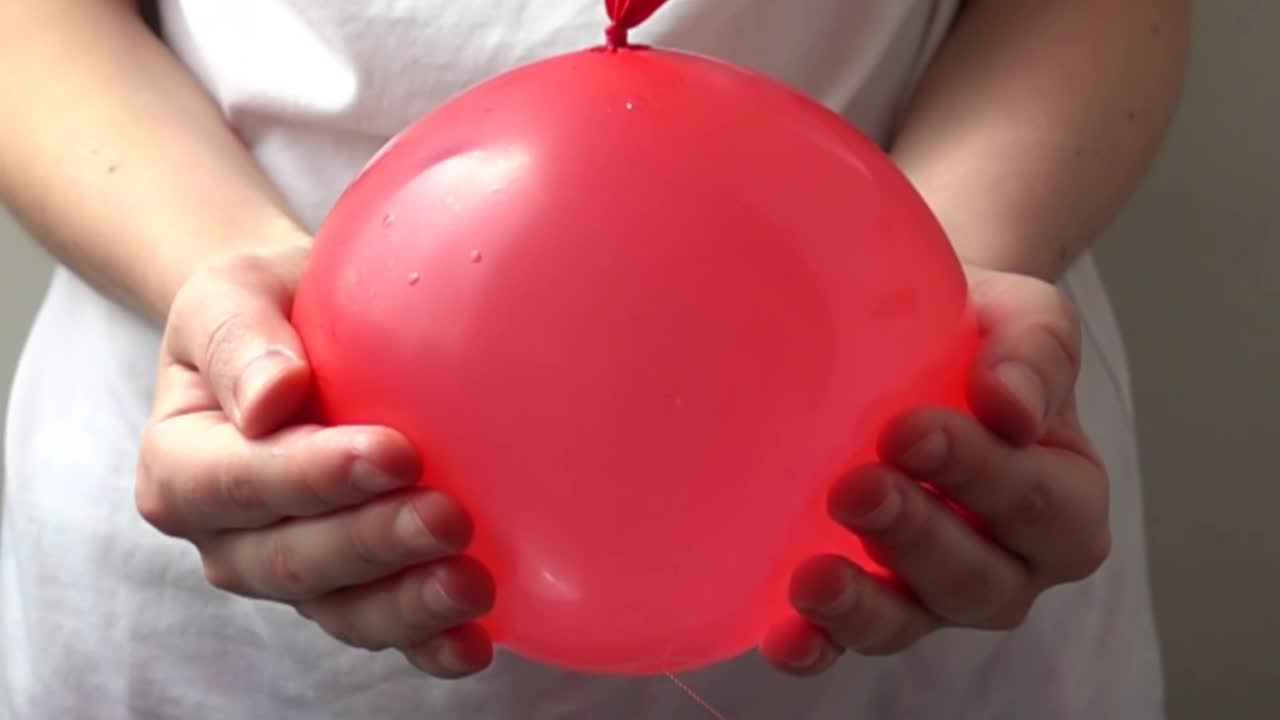 Stock Video Girl Popping A Water Balloon Live Wallpaper For PC - Free Download