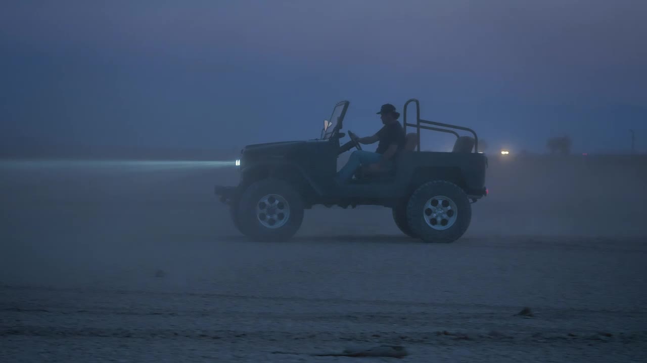 Stock Video Man Driving A Jeep In The Desert At Night Animated Wallpaper - Free Download