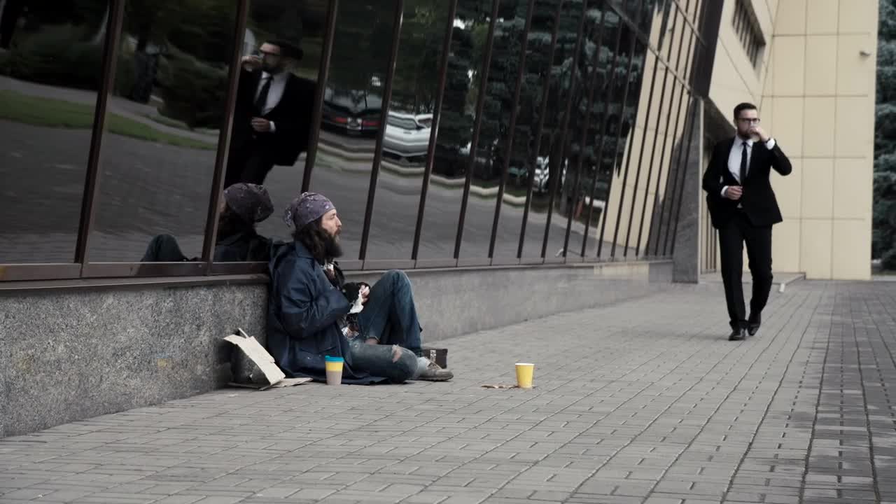 Video Stock Businessman Kicking The Beggars Coins Live Wallpaper For PC - Free Download