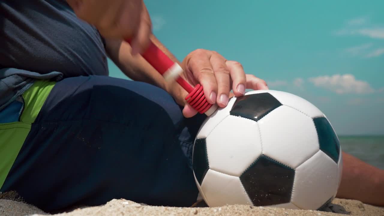 Stock Video Inflating A Ball At The Beach Animated Wallpaper - Free Download