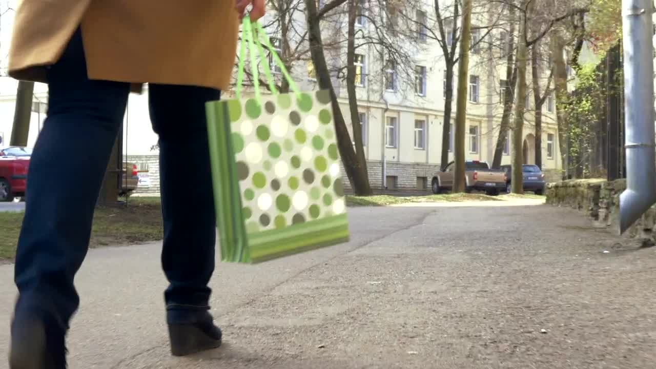 Stock Footage Walking With A Green Shopping Bag Live Wallpaper - Free Download