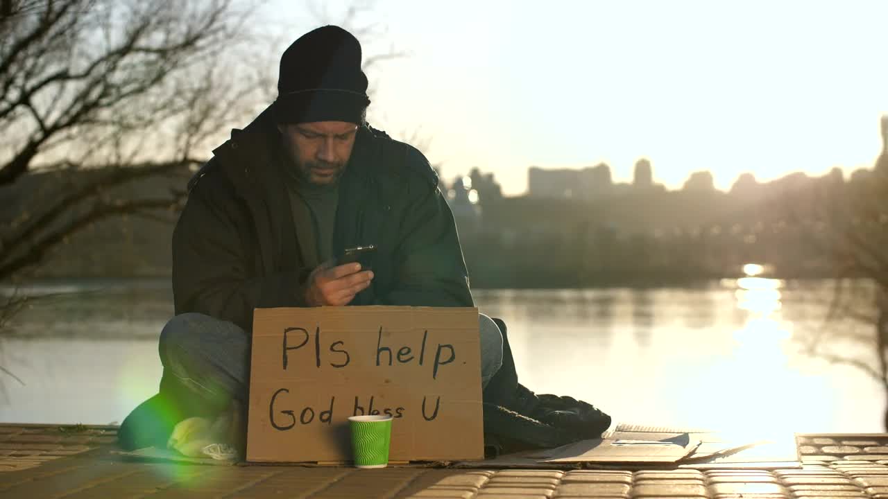 Stock Video Homeless Man With A Smartphone Animated Wallpaper - Free Download