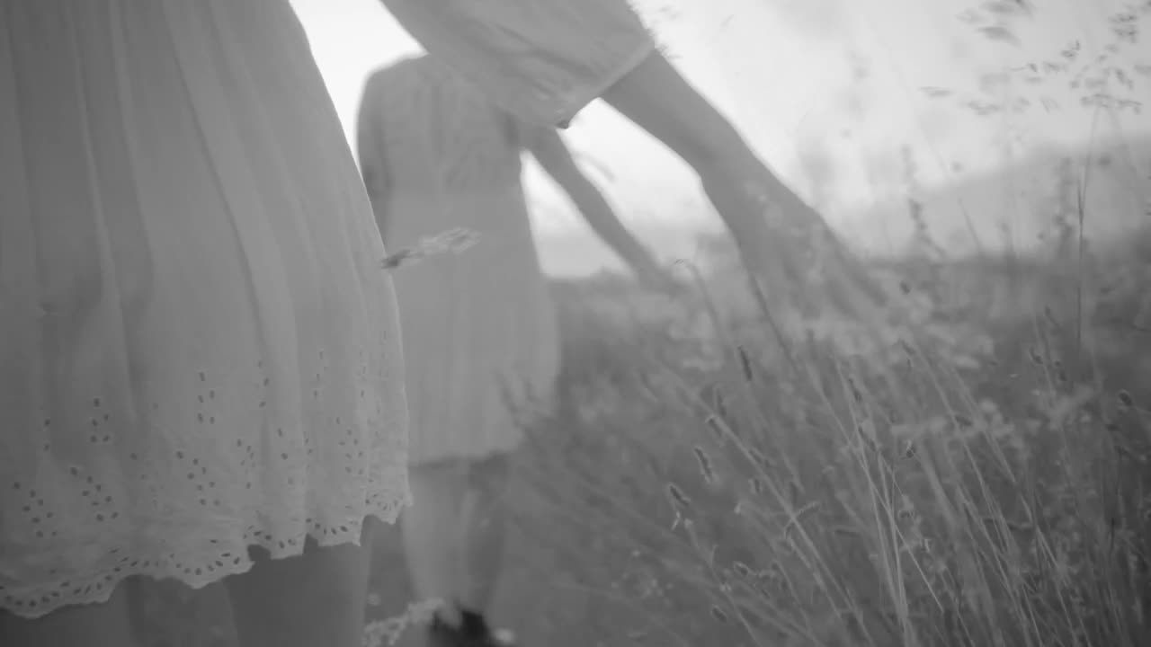 Stock Video Couple Of Women Dressed In White Walking Across The Field Live Wallpaper For PC - Free Download