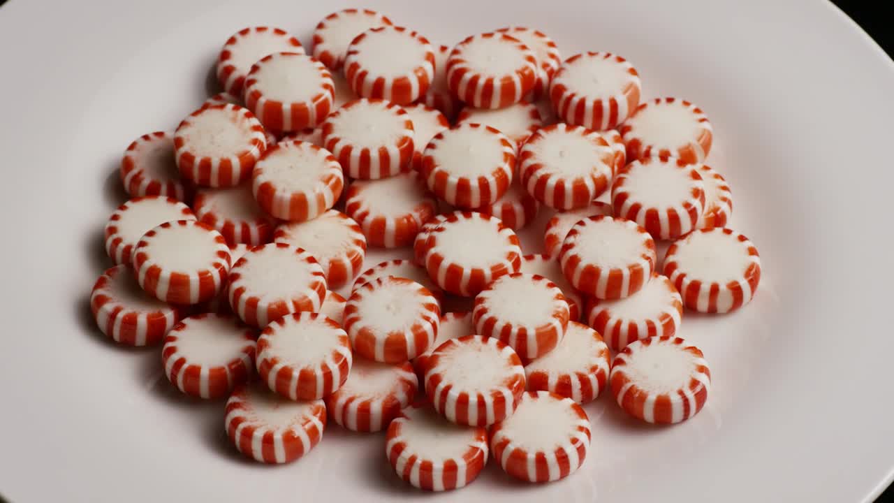Video Stock Red Spermints On A White Plate Rotating Live Wallpaper Free - Free Download
