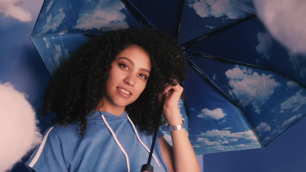 Stock Video Conceptual Portrait Of A Girl With Umbrella With Clouds Live Wallpaper For PC - Free Download