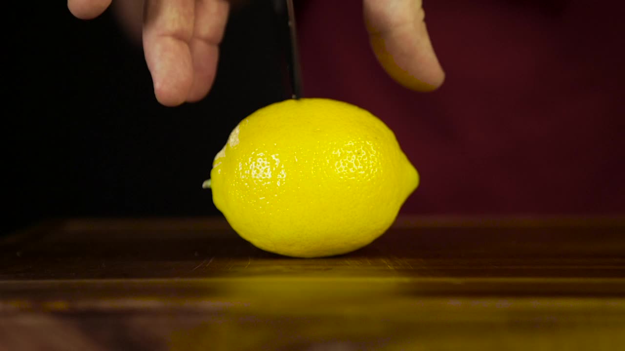 Stock Video Cutting Through A Lemon With A Knife Live Wallpaper For PC - Free Download