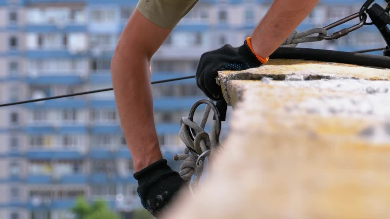 Stock Video Industrial Climber Adjusting Equipment To Work Animated Wallpaper - Free Download