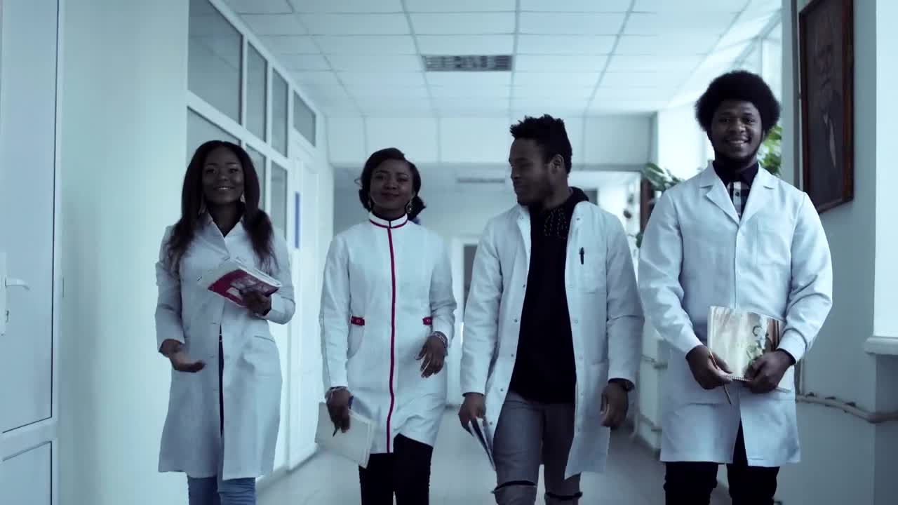 Stock Video Medical Students Walking Through The Corrido Animated Wallpaper - Free Download