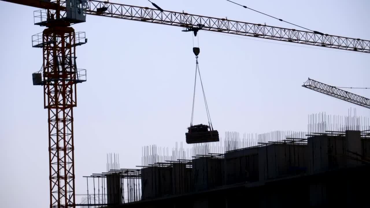 Free Video Stock tower crane silhouette on a construction site Live Wallpaper - Free Download