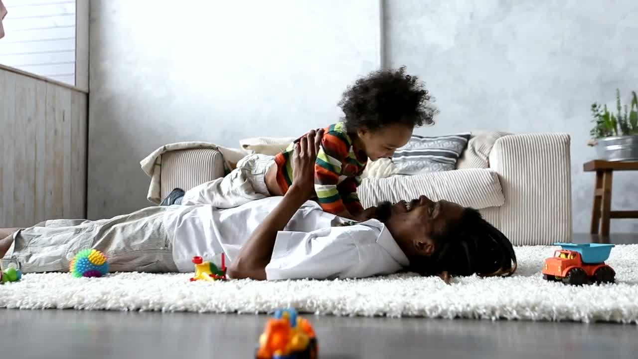 Stock Video Father Playing On The Carpet With His Little Son Live Wallpaper For PC - Free Download