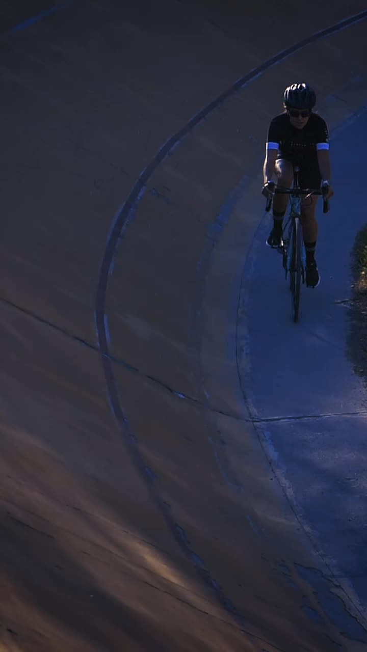 Stock Video Female Cyclist Riding Down A Cycling Track By The Edge Live Wallpaper For PC - Free Download