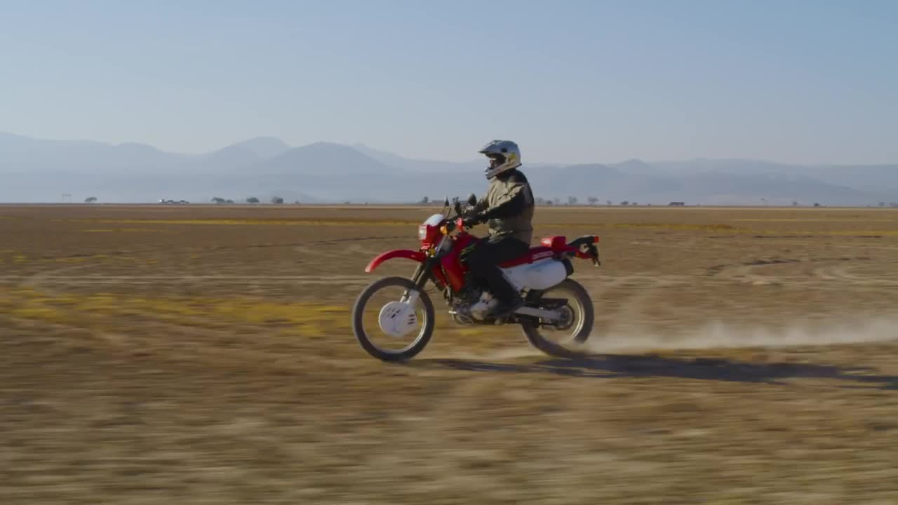 Stock Video Motorcyclist Traveling Through The Desert Live Wallpaper - Free Download