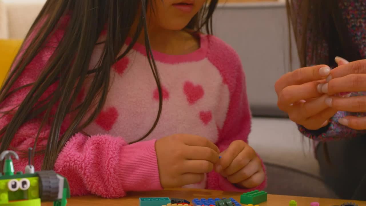 Stock Video Little Girl Playing With Legos With Mom Animated Wallpaper - Free Download