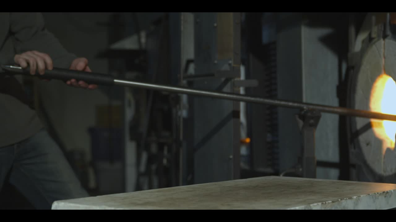 Stock Video Glazier Taking Glass Out Of A Furnace And Shaping It Live Wallpaper For PC - Free Download