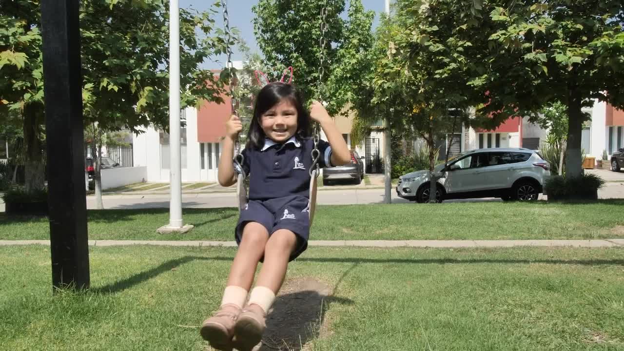 Stock Video Happy Little Girl On A Swing In A Park Animated Wallpaper - Free Download