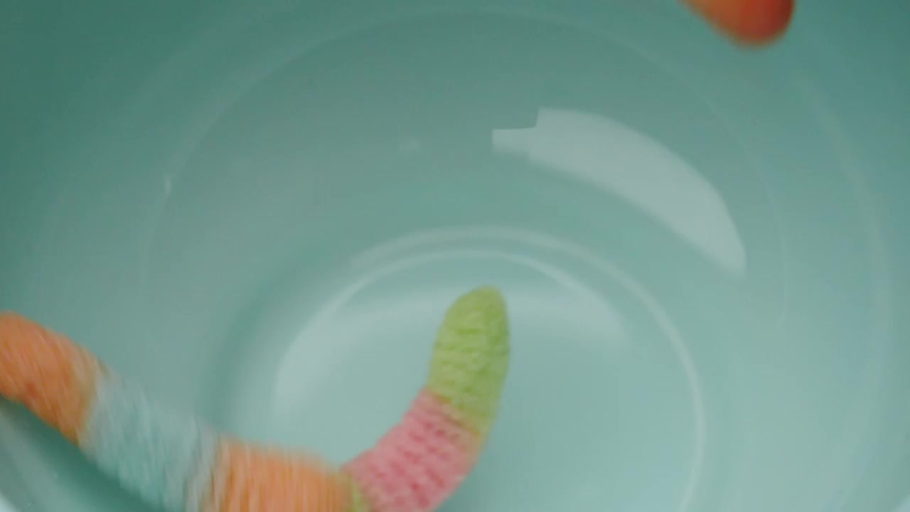 Stock Video Many Sugary Gum Worms Falling Into A Bow Animated Wallpaper - Free Download