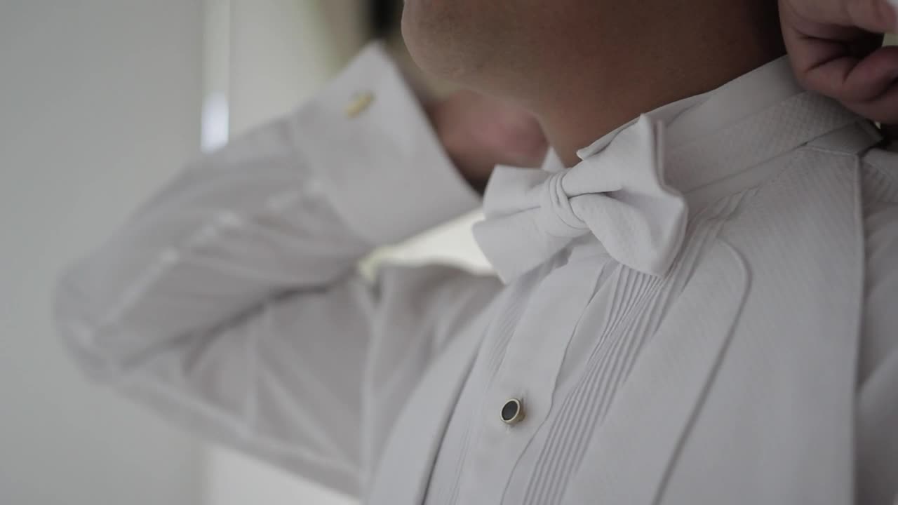 Stock Video Groom Adjusting The Bow Tie Of His Tuxedo Live Wallpaper For PC - Free Download