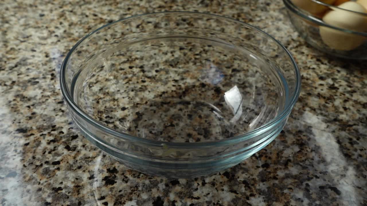 Stock Video Cracking A Raw Egg Into A Glass Bowl Live Wallpaper For PC - Free Download