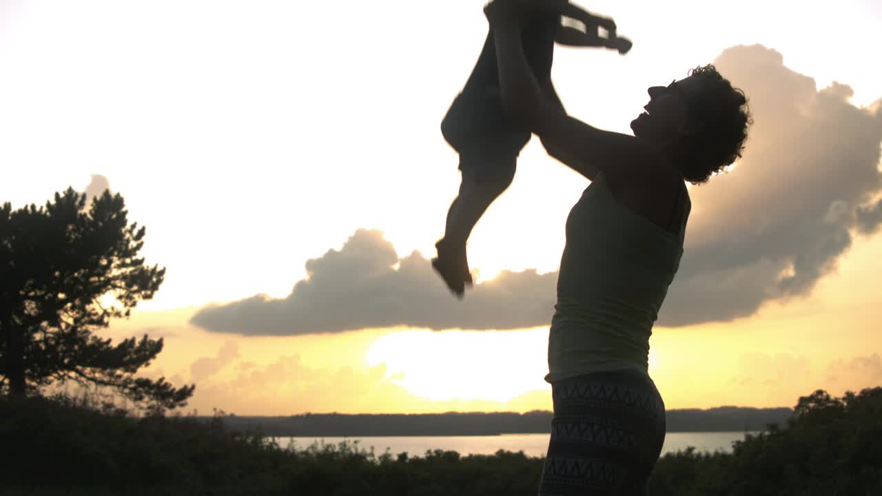 Stock Video Mother Throwing Her Son Upward Animated Wallpaper - Free Download