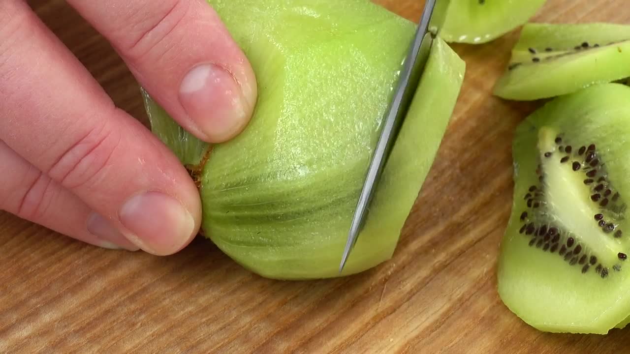 Stock Video Hands Slicing A Kiwi Animated Wallpaper - Free Download