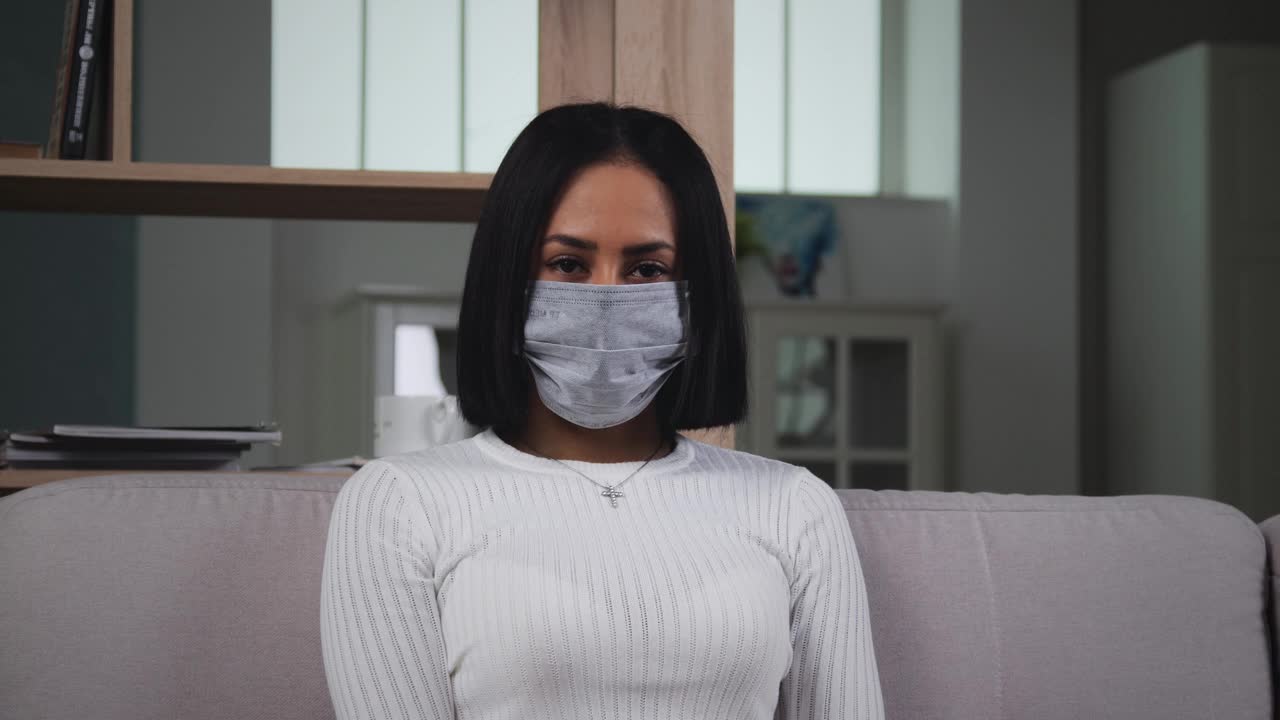 Free Stock Video Woman With Medical Face Mask Looking To Camera Live Wallpaper - Free Download