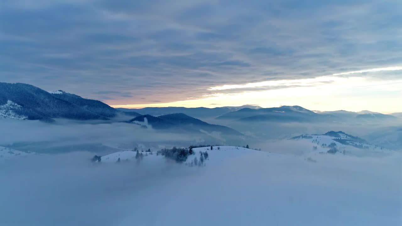 Free Video Stock thick layer of clouds over snowy mountains Live Wallpaper - Free Download
