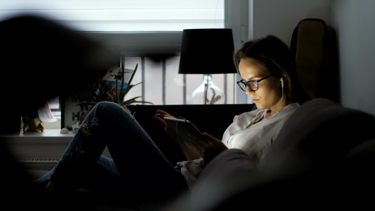 Free Stock Video Woman Using A Tablet Lying On The Couch Live Wallpaper - Free Download