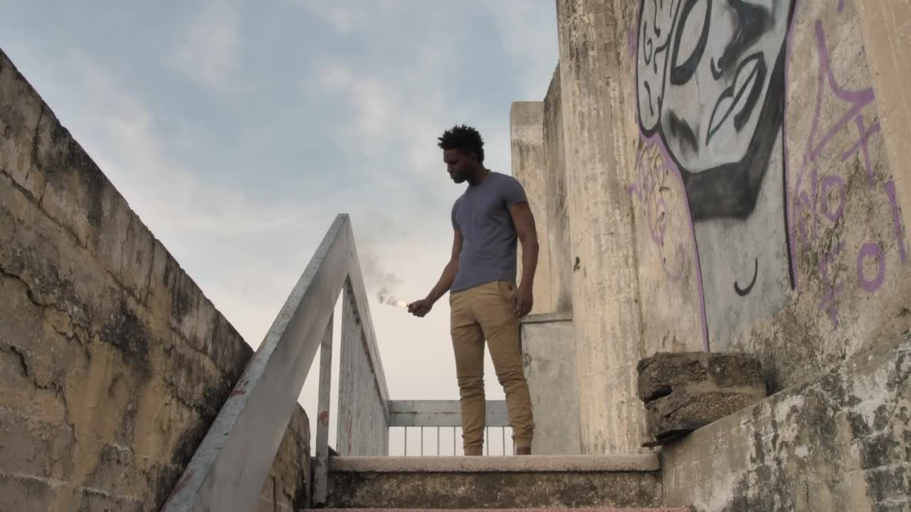 Stock Video Man With Smoke Bomb On Staircas Animated Wallpaper - Free Download