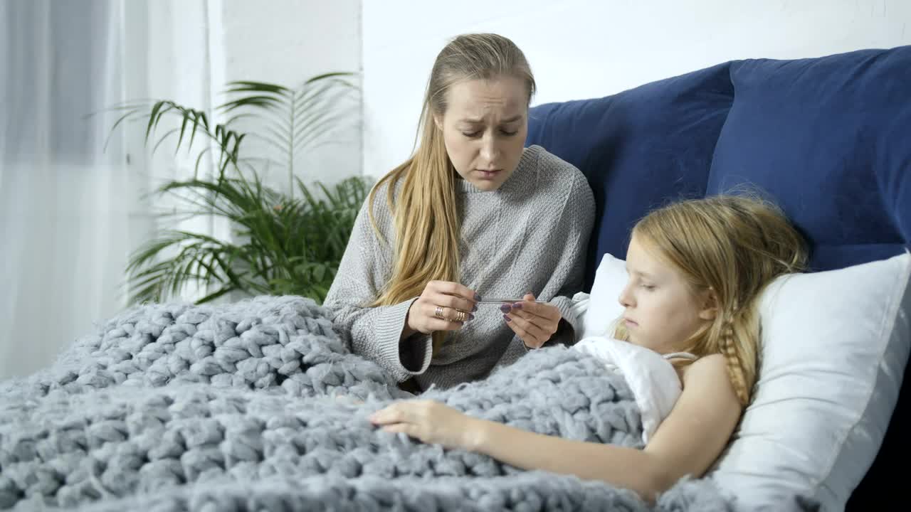 Stock Video Mother Using A Thermomete Animated Wallpaper - Free Download