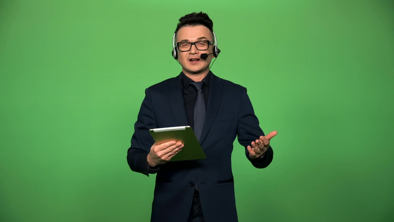 Stock Video Newscaster With Tablet And Headset Speaking Live Wallpaper - Free Download