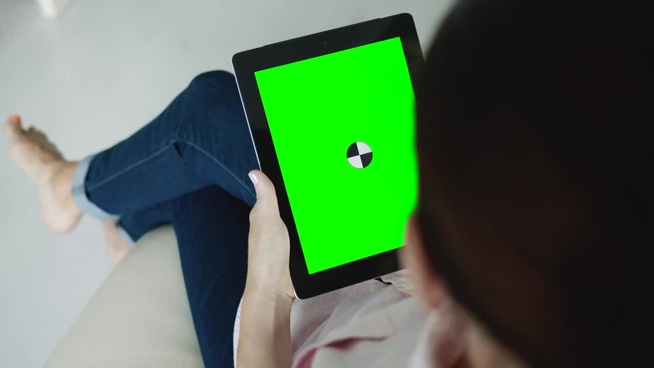 Free Stock Video Sitting Woman Holding Greenscreen Tablet With Chroma Key Live Wallpaper - Free Download