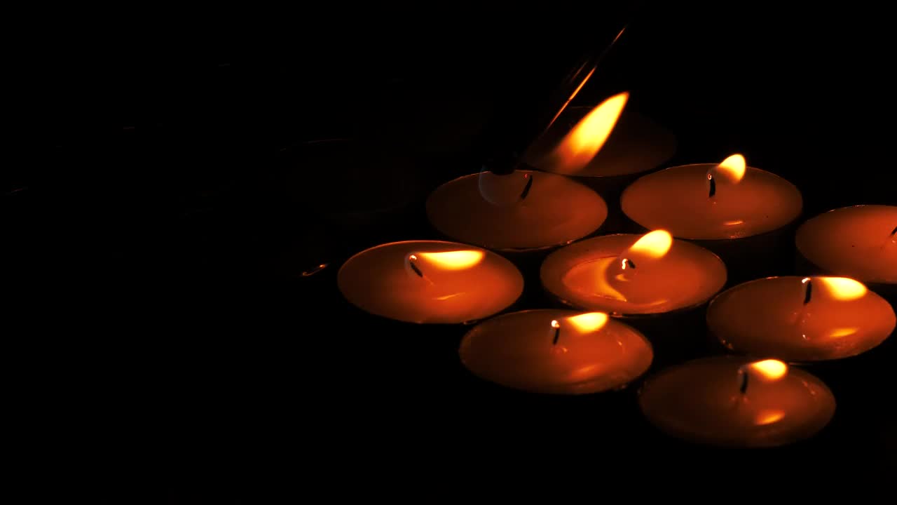 Stock Video Lighting Candles In The Dark Animated Wallpaper - Free Download
