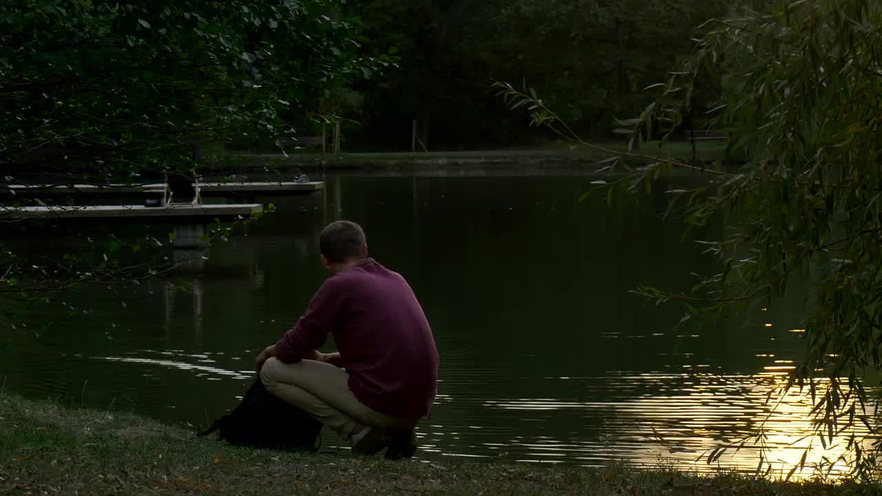 Free Stock Video Young Man Walks Away From A Lake After Appreciating It Live Wallpaper - Free Download