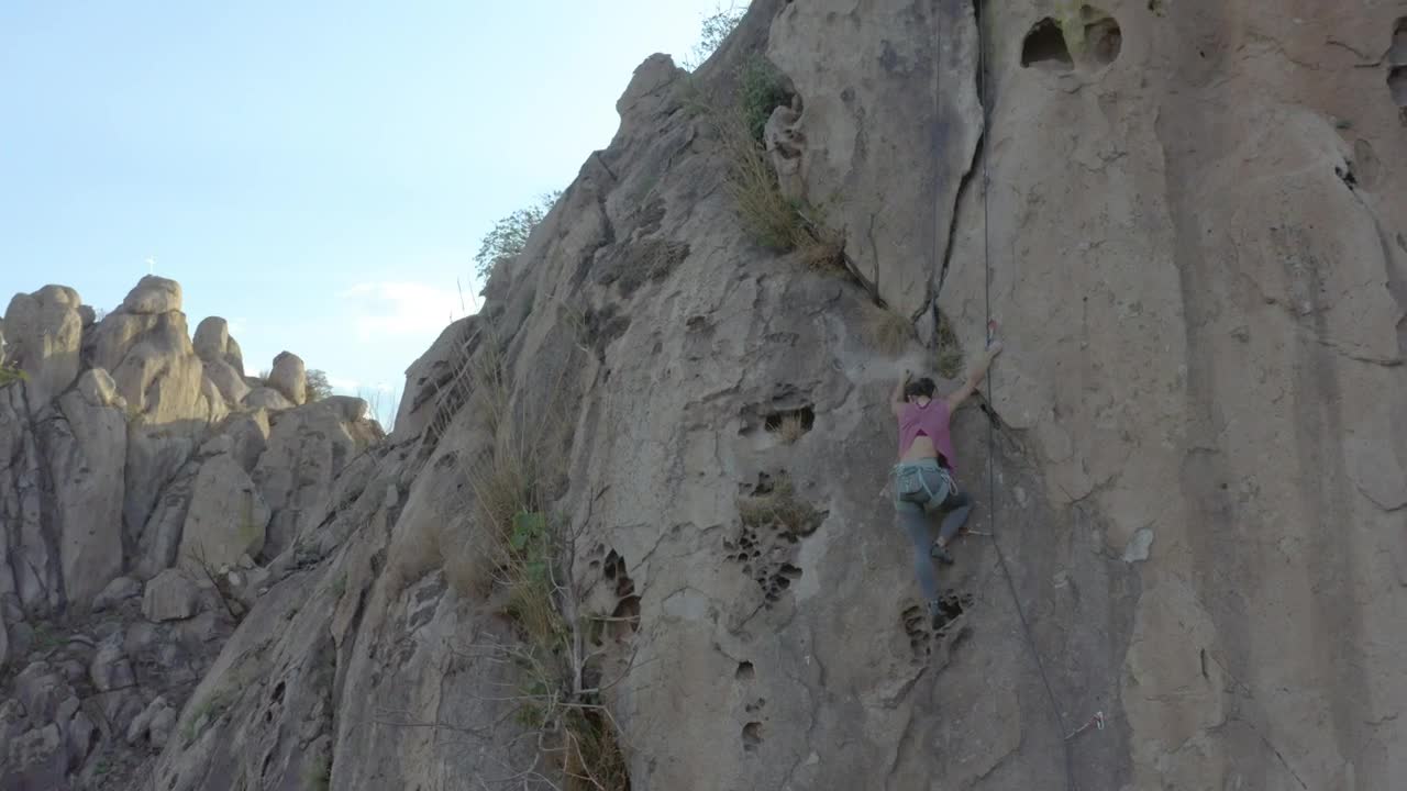 Stock Video Mountaineer Girl Climbing A Steep Rocky Mountain Live Wallpaper - Free Download