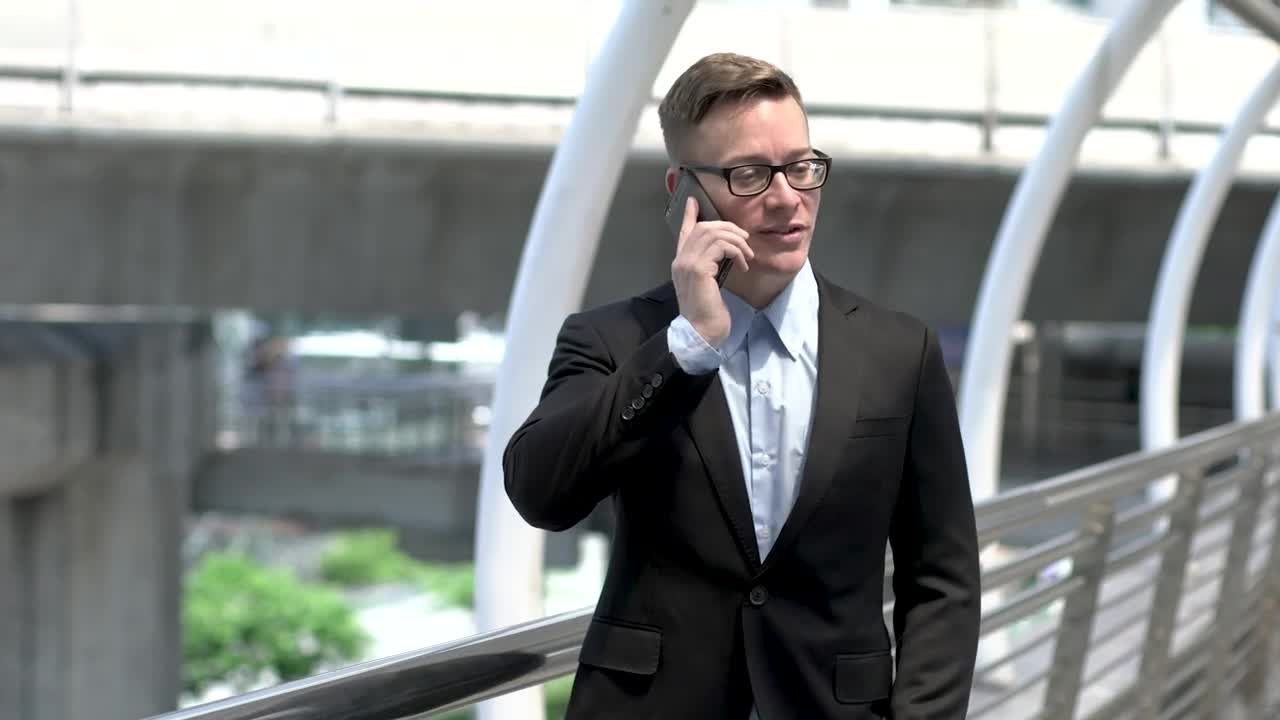 Stock Video Man In A Suit Talking On His Mobile Phone Animated Wallpaper - Free Download