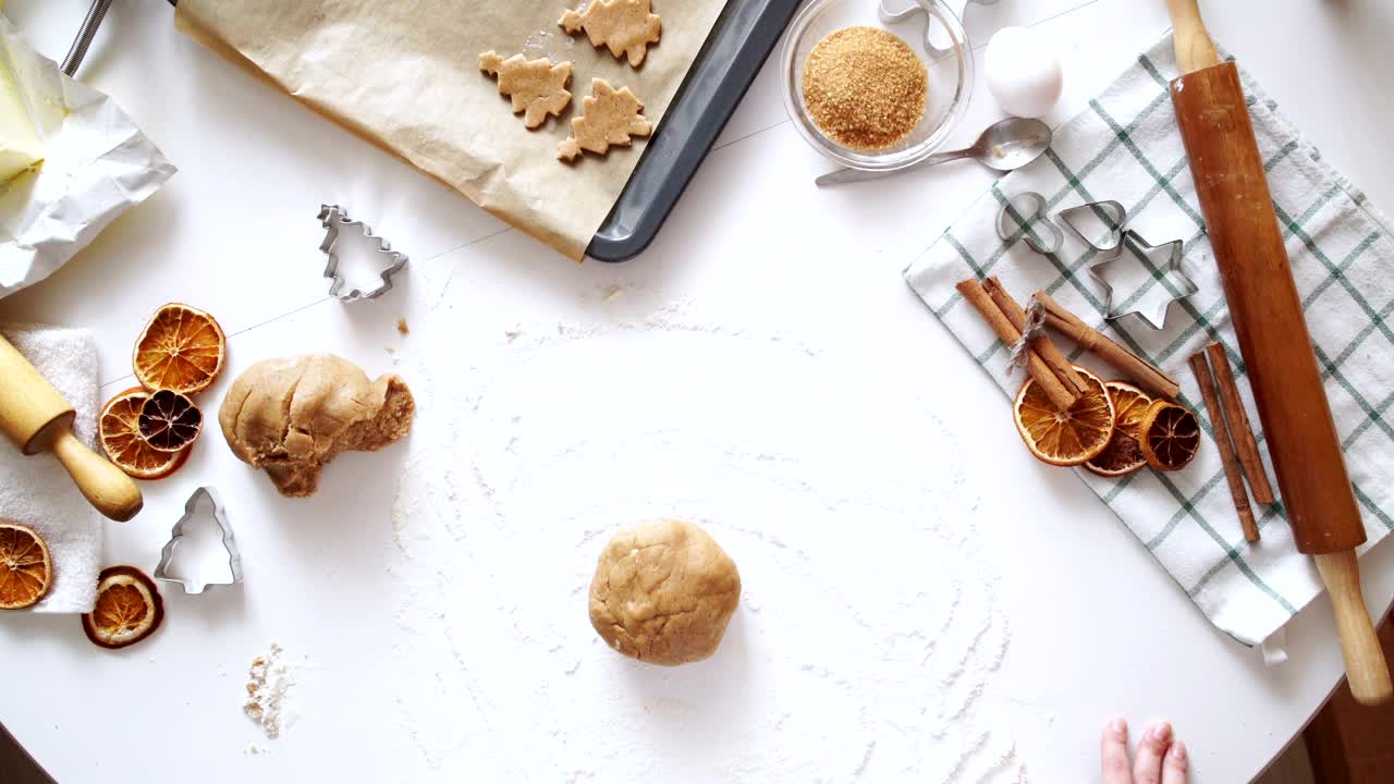 Free Video Stock top view of rolling cookie dough cinnamon and baking tools Live Wallpaper - Free Download
