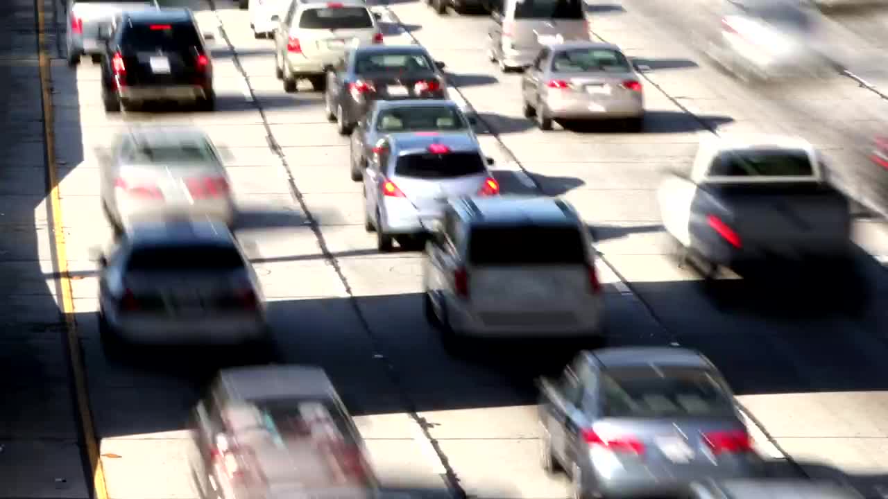 Stock Video High View Of Traffic From A Four Lane Highway Animated Wallpaper - Free Download