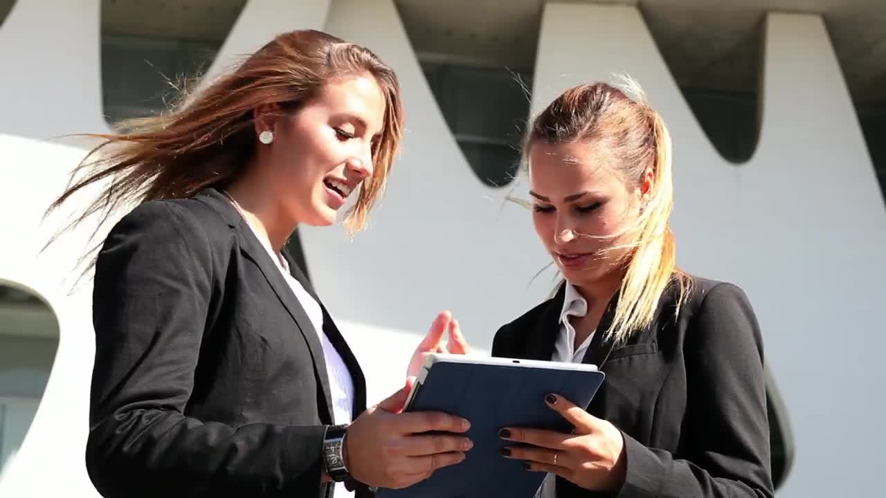 Free Stock Video Two Business Women Commenting On Something On A Tablet Live Wallpaper - Free Download