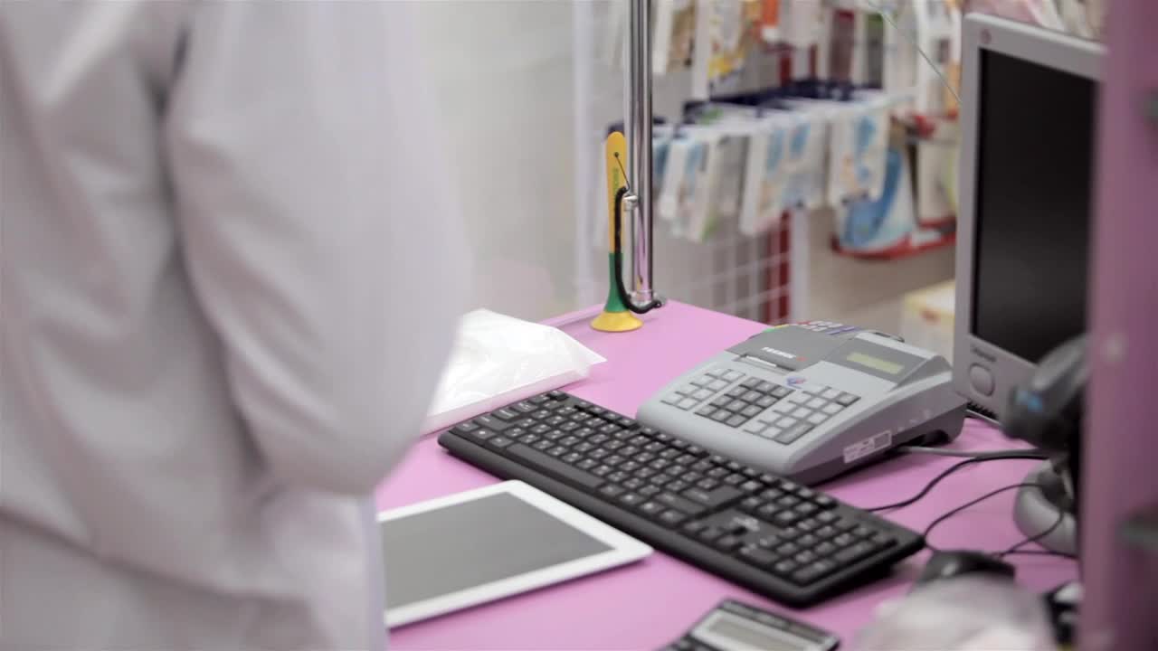 Video Stock Pharmacy Worker Accepts Payment At Checkout Live Wallpaper Free - Free Download
