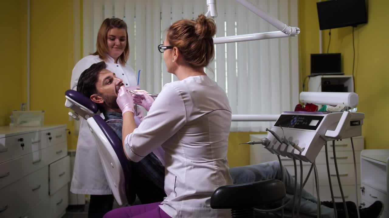 Stock Video Dental Assistant Working With A Patient Live Wallpaper For PC - Free Download