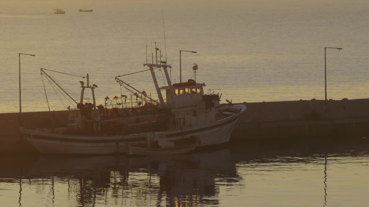 Stock Video Fishing Boat Anchored In A Harbor Town Live Wallpaper For PC - Free Download