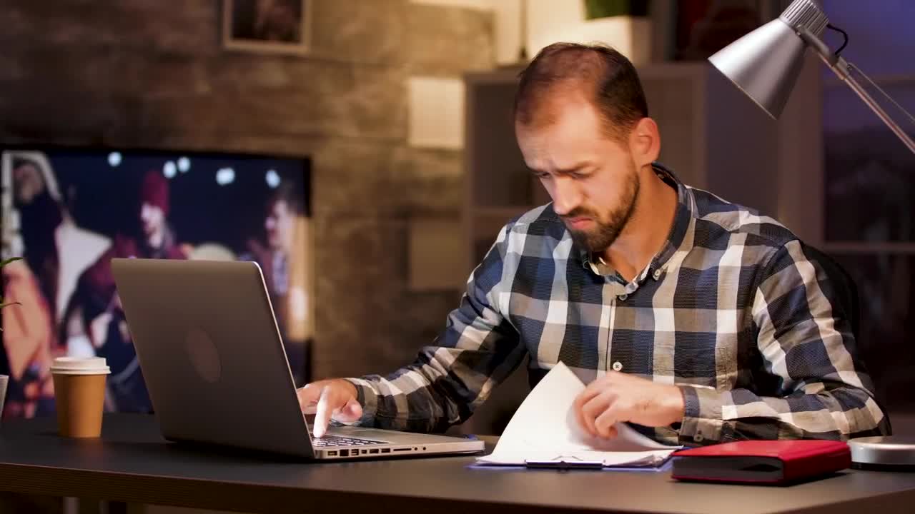 Stock Video Man Doing Research On Laptop From Home Office Animated Wallpaper - Free Download