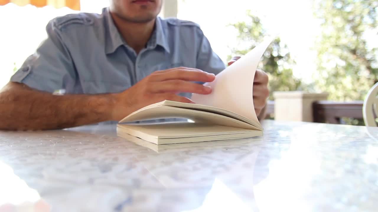 Video Stock Chico Leafing Through A Book To Start Reading Live Wallpaper For PC - Free Download