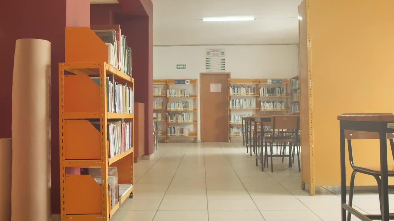 Stock Footage Walking Down A Library Corridor With Tables And Bookcases Live Wallpaper - Free Download