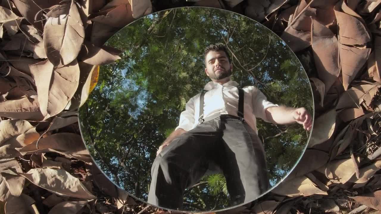 Free Stock Video Young Man Picking Up A Mirror In A Forest Live Wallpaper - Free Download