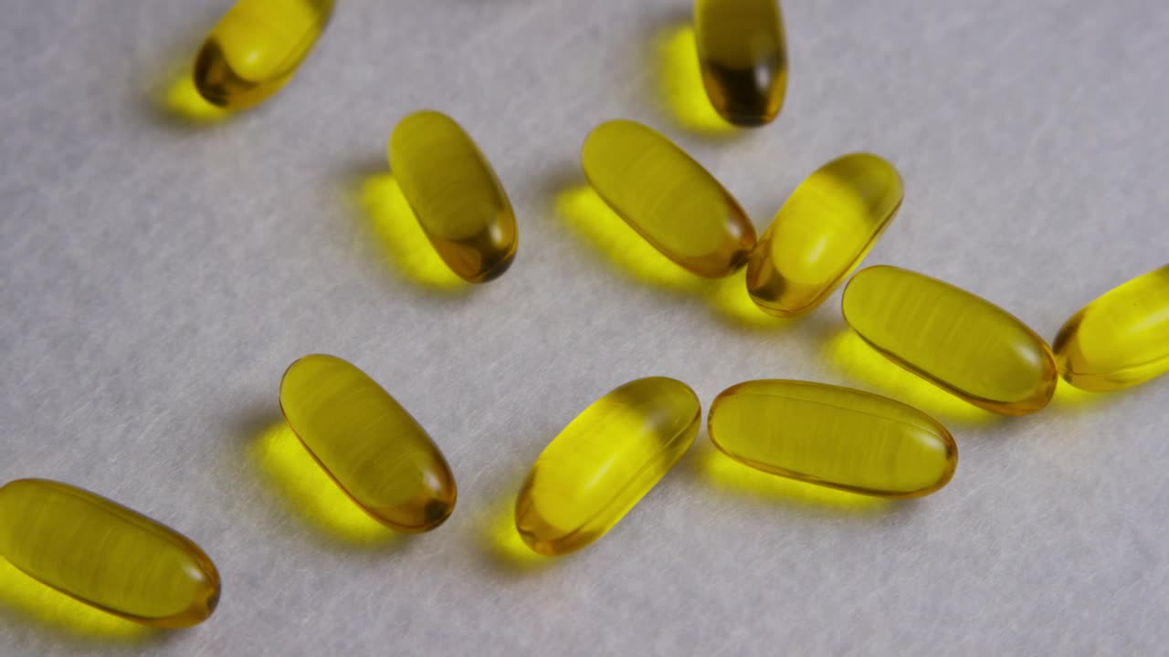 Free Stock Video Yellow Colored Pills Over A Wide Fabric Live Wallpaper - Free Download