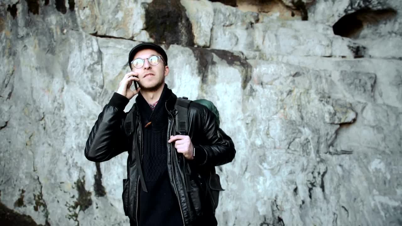 Free Video Stock tourist taking a call on a cave Live Wallpaper - Free Download